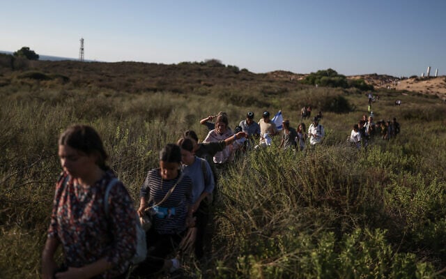 This picture taken from a position on the Israeli border with the Gaza Strip shows settler activists attempting to make their way into the Palestinian territory on July 19, 2026. (Ilia YEFIMOVICH/AFP)