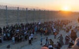 Israeli right-wing activists advocating Jewish settlement in Gaza gather on the border with the Gaza Strip as they attempt to cross over into the territory on July 19, 2026. (Ilia Yefimovich/AFP)