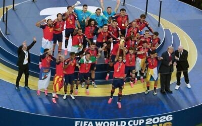 Spain’s captain Rodri lifts up the World Cup trophy as Spain’s players, Spain’s head coach Luis de la Fuente (L), US President Donald Trump (2R) and FIFA President Gianni Infantino (right) celebrate during the presentation ceremony after the 2026 World Cup final, in which Spain defeated Argentina 1-0 at the New York/New Jersey Stadium in East Rutherford on July 19, 2026. (TIMOTHY A. CLARY/AFP) Spain’s captain Rodri lifts up the World Cup trophy as Spain’s players, Spain’s head coach Luis de la Fuente (L), US President Donald Trump (2R) and FIFA President Gianni Infantino (right) celebrate during the presentation ceremony after the 2026 World Cup final, in which Spain defeated Argentina 1-0 at the New York/New Jersey Stadium in East Rutherford on July 19, 2026. (TIMOTHY A. CLARY/AFP)