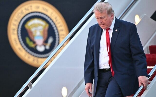 US President Donald Trump steps off Air Force One upon arrival at Joint Base Andrews in Maryland on July 19, 2026. (Mandel NGAN/AFP)