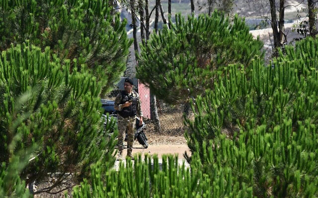 A Lebanese army soldier stands guard at a checkpoint after entering the southern Lebanese village of Zawtar on July 21, 2026. (Fadel ITANI/AFP)