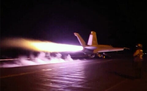 This screen grab made on July 22, 2026 from handout video footage released by the US Central Command on July 21, 2026 shows US forces launching what the military says are precision strikes targeting Iranian military capabilities for the eleventh consecutive night. (CENTCOM via AFP)