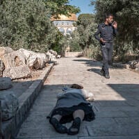 Illustrative: An Israeli Jewish woman prostrates herself on the Temple Mount in Jerusalem on July 23, 2026. (Ilia YEFIMOVICH/AFP)