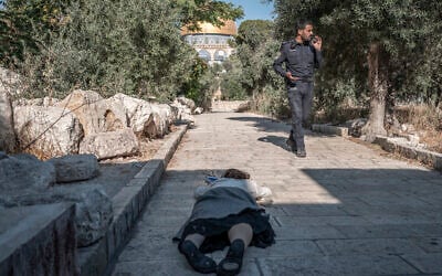 Illustrative: An Israeli Jewish woman prostrates herself on the Temple Mount in Jerusalem on July 23, 2026. (Ilia YEFIMOVICH/AFP) Illustrative: An Israeli Jewish woman prostrates herself on the Temple Mount in Jerusalem on July 23, 2026. (Ilia YEFIMOVICH/AFP)
