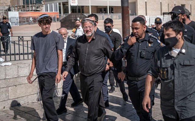 National Security Minister Itamar Ben Gvir (C) enters the Temple Mount during the day of Tisha B’Av, in Jerusalem, on July 23, 2026. (ilia YEFIMOVICH/AFP)