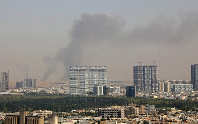 Smoke rises after explosions were heard and air defences activated near the airport in Erbil, on July 24, 2026. (AFP)