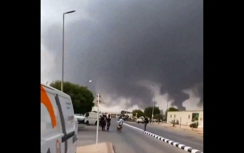This screen grab taken on July 25, 2026 from UGC video footage posted on social media and verified by AFPTV teams shows clouds of smoke rising after strikes on the Saudi Aramco refinery in Jizan. (various sources/AFP) This screen grab taken on July 25, 2026 from UGC video footage posted on social media and verified by AFPTV teams shows clouds of smoke rising after strikes on the Saudi Aramco refinery in Jizan. (various sources/AFP)