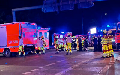 Police and security personnel work near the scene where several people were injured in a potential car-ramming on the sideline of the Christopher Street Day (CSD) parade in Berlin, Germany, on July 25, 2026. (Antoine LAMBROSCHINI/AFP)