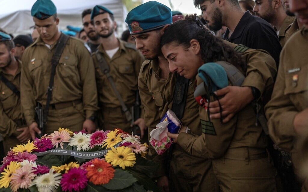 Soldiers grieve during the funeral of Maj. Yuval Ezra, 27, killed in the Palestinian West Bank, at a cemetery in Bet Dagan, central Israel on July 26, 2026. (ilia YEFIMOVICH/AFP) Soldiers grieve during the funeral of Maj. Yuval Ezra, 27, killed in the Palestinian West Bank, at a cemetery in Bet Dagan, central Israel on July 26, 2026. (ilia YEFIMOVICH/AFP)
