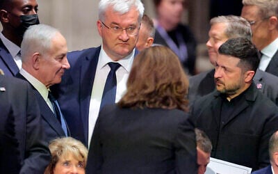 Prime Minister Benjamin Netanyahu (left), Ukrainian Foreign Minister Andrii Sybiha, and Ukraine President Volodymyr Zelensky (right) attend the funeral service for US Sen. Lindsey Graham at the Washington National Cathedral on July 28, 2026 in Washington, DC. (Chip Somodevilla/Getty Images/AFP)