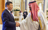 Saudi Crown Prince and Prime Minister Mohammed bin Salman, right, greets Chinese President Xi Jinping, during the Gulf Cooperation Council Summit, in Riyadh, Saudi Arabia, December 9, 2022. (Saudi Press Agency via AP)