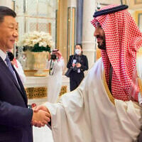 Saudi Crown Prince and Prime Minister Mohammed bin Salman, right, greets Chinese President Xi Jinping, during the Gulf Cooperation Council Summit, in Riyadh, Saudi Arabia, December 9, 2022. (Saudi Press Agency via AP)