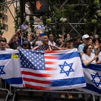 People holding Israeli and American flags gather for the annual Israel Day Parade on Fifth Avenue on June 2, 2024, in New York (AP Photo/Yuki Iwamura)