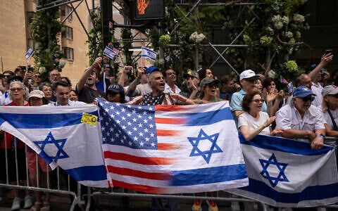 People holding Israeli and American flags gather for the annual Israel Day Parade on Fifth Avenue on June 2, 2024, in New York (AP Photo/Yuki Iwamura)