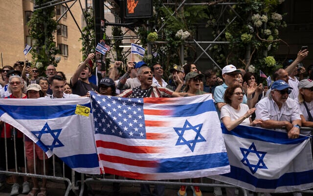 People holding Israeli and American flags gather for the annual Israel Day Parade on Fifth Avenue on June 2, 2024, in New York (AP Photo/Yuki Iwamura)