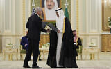 US Secretary of Energy Chris Wright, left, and Saudi Arabia Energy Minister Prince Abdulaziz Bin Salman, shake hands after exchanging documents during a signing ceremony at the Royal Palace in Riyadh, Saudi Arabia, May 13, 2025. (Alex Brandon/AP/File)