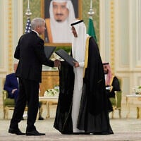 Chris Wright, US Secretary of Energy, left, and Saudi Arabia Energy Minister Prince Abdulaziz Bin Salman, shake hands after exchanging documents during a signing ceremony at the Royal Palace in Riyadh, Saudi Arabia, May 13, 2025. (Alex Brandon/AP)