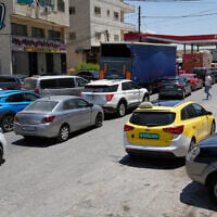 Palestinian motorists queue at a gas station while the city is experiencing a severe fuel shortage following the Israel Iran conflict, in Ramallah June 19, 2025. (AP Photo/Nasser Nasser)