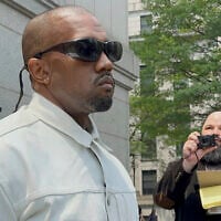 Ye, the rapper formerly known as Kanye West, leaves federal court during the trial of Sean "Diddy" Combs in New York, June 13, 2025. (AP Photo/Larry Neumeister)