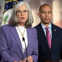US House Minority Whip Katherine Clark speaks as House Minority Leader Hakeem Jeffries listens during a press conference on Capitol Hill on October 1, 2025, in Washington. (AP/Mark Schiefelbein)