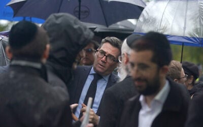 Then-mayor of Greater Manchester Andy Burnham talks to people as he attends a vigil for the victims of the terror attack at Heaton Park Hebrew Congregation synagogue, in Crumpsall, Manchester, England, October 3, 2025. (AP Photo/Ian Hodgson)