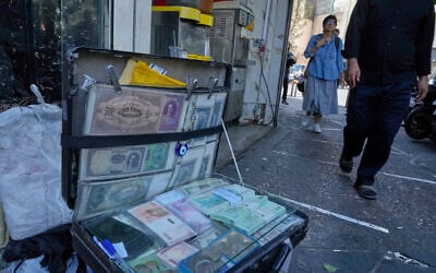 Current and pre-revolution Iranian banknotes are displayed by a street money exchanger at Ferdowsi square, Tehran’s go-to venue for foreign currency exchange, in downtown Tehran, Iran, on August 28, 2025. (AP Photo/Vahid Salemi) Current and pre-revolution Iranian banknotes are displayed by a street money exchanger at Ferdowsi square, Tehran’s go-to venue for foreign currency exchange, in downtown Tehran, Iran, on August 28, 2025. (AP Photo/Vahid Salemi)