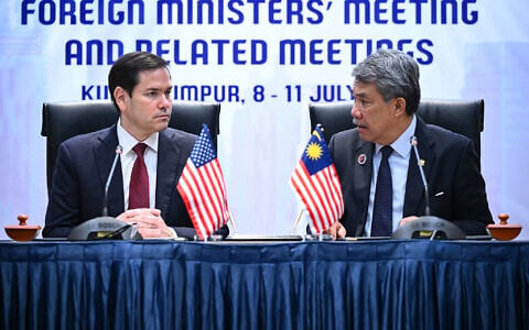 US Secretary of State Marco Rubio, left, takes part in a memorandum of understanding signing with Malaysia’s Minister of Foreign Affairs Mohamad Hasan during the 58th Association of Southeast Asian Nations (ASEAN) Foreign Ministers’ meeting and related meetings at the Convention Center in Kuala Lumpur, July 10, 2025. (Mandel Ngan/Pool via AP)