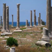 People check Roman-era ruins after an Israeli airstrike hit an area nearby, in the southern port city of Tyre, June 12, 2026. (AP Photo/Mohammed Zaatari)