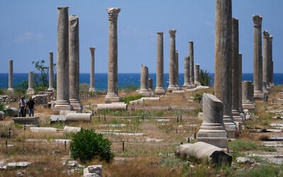 People check Roman-era ruins after an Israeli airstrike hit an area nearby, in the southern port city of Tyre, June 12, 2026. (AP Photo/Mohammed Zaatari)