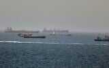 Tankers and cargo vessels are seen in the Gulf of Oman, along shipping routes linking the Strait of Hormuz and the Arabian Sea, June 16, 2026. (AP Photo)