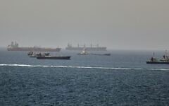 Tankers and cargo vessels are seen in the Gulf of Oman, along shipping routes linking the Strait of Hormuz and the Arabian Sea, June 16, 2026. (AP Photo)