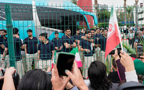Fans greet members of the Iran World Cup soccer team as they leave their hotel for the airport, June 30, 2026, in Tijuana, Mexico. (AP Photo/Gregory Bull)
