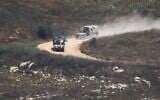 Israeli soldiers drive in southern Lebanon as seen from northern Israel, July 1, 2026. (AP Photo/Ariel Schalit)