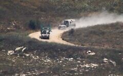 Israeli soldiers drive in southern Lebanon as seen from northern Israel, July 1, 2026. (AP Photo/Ariel Schalit)