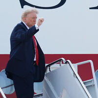 US President Donald Trump waves as he boards the newly-designated Air Force One, a formerly Qatari-owned jumbo jet that has been converted into the official US presidential aircraft, at Joint Base Andrews, Maryland, July 1, 2026. (AP/Luis M. Alvarez)