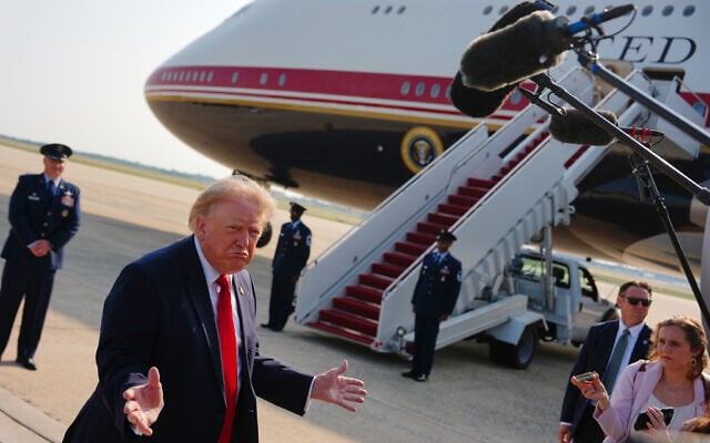 US President Donald Trump speaks to reporters before boarding Air Force One, at Joint Base Andrews, Maryland, July 1, 2026. (Julia Demaree Nikhinson/AP) US President Donald Trump speaks to reporters before boarding Air Force One, at Joint Base Andrews, Maryland, July 1, 2026. (Julia Demaree Nikhinson/AP)