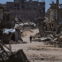 A Palestinian child walks along a street surrounded by buildings destroyed in Israeli military strikes during the Israel-Hamas war in Khan Younis, Gaza Strip, July 1, 2026. (AP Photo/Abdel Kareem Hana) A Palestinian child walks along a street surrounded by buildings destroyed in Israeli military strikes during the Israel-Hamas war in Khan Younis, Gaza Strip, July 1, 2026. (AP Photo/Abdel Kareem Hana)