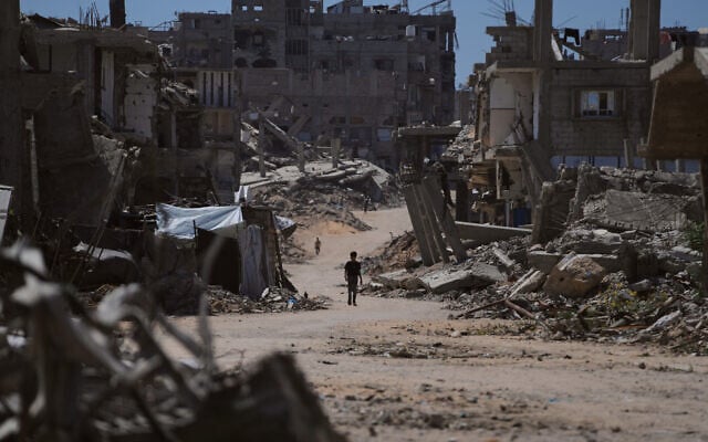 A Palestinian child walks along a street surrounded by buildings destroyed in Israeli military strikes during the Israel-Hamas war in Khan Younis, Gaza Strip, July 1, 2026. (AP Photo/Abdel Kareem Hana) A Palestinian child walks along a street surrounded by buildings destroyed in Israeli military strikes during the Israel-Hamas war in Khan Younis, Gaza Strip, July 1, 2026. (AP Photo/Abdel Kareem Hana)