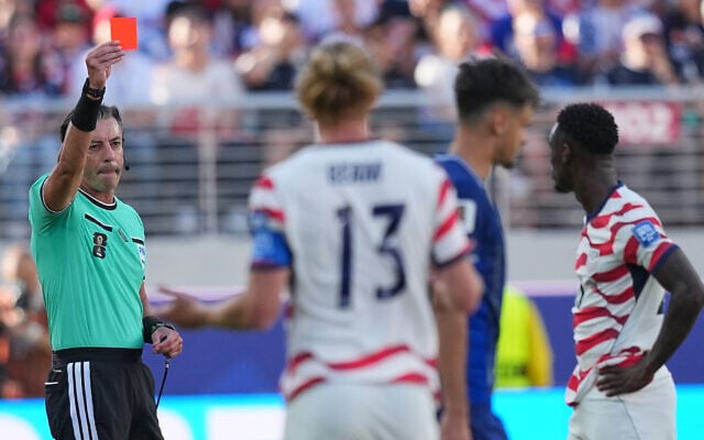 Referee Raphael Claus of Brazil shows a red card to United States' Folarin Balogun, right, during the World Cup round of 32 soccer match between the United States and Bosnia in Santa Clara, California, July 1, 2026. (AP Photo/Julio Cortez) Referee Raphael Claus of Brazil shows a red card to United States' Folarin Balogun, right, during the World Cup round of 32 soccer match between the United States and Bosnia in Santa Clara, California, July 1, 2026. (AP Photo/Julio Cortez)