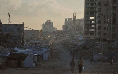 Palestinians walk along a street surrounded by buildings destroyed in Israeli military strikes during the Israel-Hamas war, in Gaza City, Thursday, July 2, 2026. (AP/Jehad Alshrafi) Palestinians walk along a street surrounded by buildings destroyed in Israeli military strikes during the Israel-Hamas war, in Gaza City, Thursday, July 2, 2026. (AP/Jehad Alshrafi)