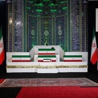 The coffins of slain Iranian supreme leader Ali Khamenei, center top, and members of his family are displayed ahead of the days-long funeral ceremonies at the Imam Khomeini Mosalla Grand Mosque in Tehran, Iran, July 3, 2026. (AP Photo/Vahid Salemi)