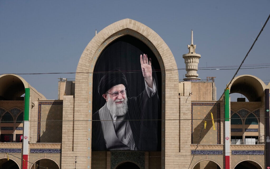 A portrait of the slain Iranian Supreme Leader Ayatollah Ali Khamenei hangs at the Imam Khomeini Mosalla Grand Mosque as preparations are underway ahead of his dayslong funeral ceremonies in Tehran, Iran, July 3, 2026. (AP Photo/Vahid Salemi)