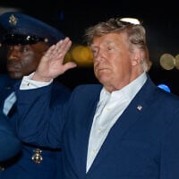 US President Donald Trump salutes as he arrives on Air Force One, July 4, 2026, at Joint Base Andrews, Maryland. (AP Photo/Alex Brandon)