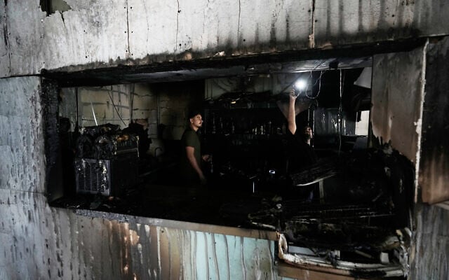 Palestinians inspect the remains of a restaurant that was set on fire overnight by Israeli settlers near the West Bank town of Salfit, July 5, 2026. (AP Photo/Majdi Mohammad) Palestinians inspect the remains of a restaurant that was set on fire overnight by Israeli settlers near the West Bank town of Salfit, July 5, 2026. (AP Photo/Majdi Mohammad)