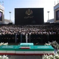 In this photo released by Iran's supreme leader's office, Iran's top officials, including the brothers of Iran's new supreme leader, attend funeral prayers over the coffins of the late ayatollah Ali Khamenei and members of his family at the Imam Khomeini Mosalla Grand Mosque in Tehran, Iran, Sunday, July 5, 2026. (Office of the Iranian Supreme Leader via AP)