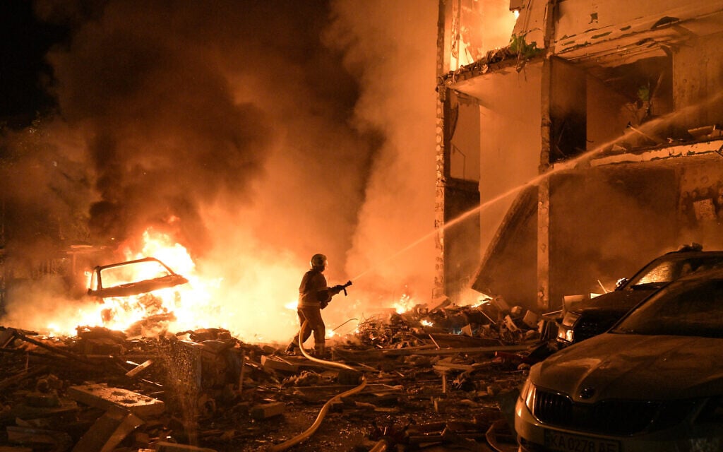 Emergency services personnel work to extinguish a fire following Russian missile attacks in Kyiv, Ukraine, July 6, 2026. (AP Photo/Danylo Antoniuk)