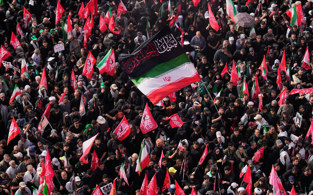 Mourners gather in and around Islamic Revolution Square during the funeral procession of the slain Iranian supreme leader Ali Khamenei in Tehran, Iran, July 6, 2026. (AP Photo/Altaf Qadri)