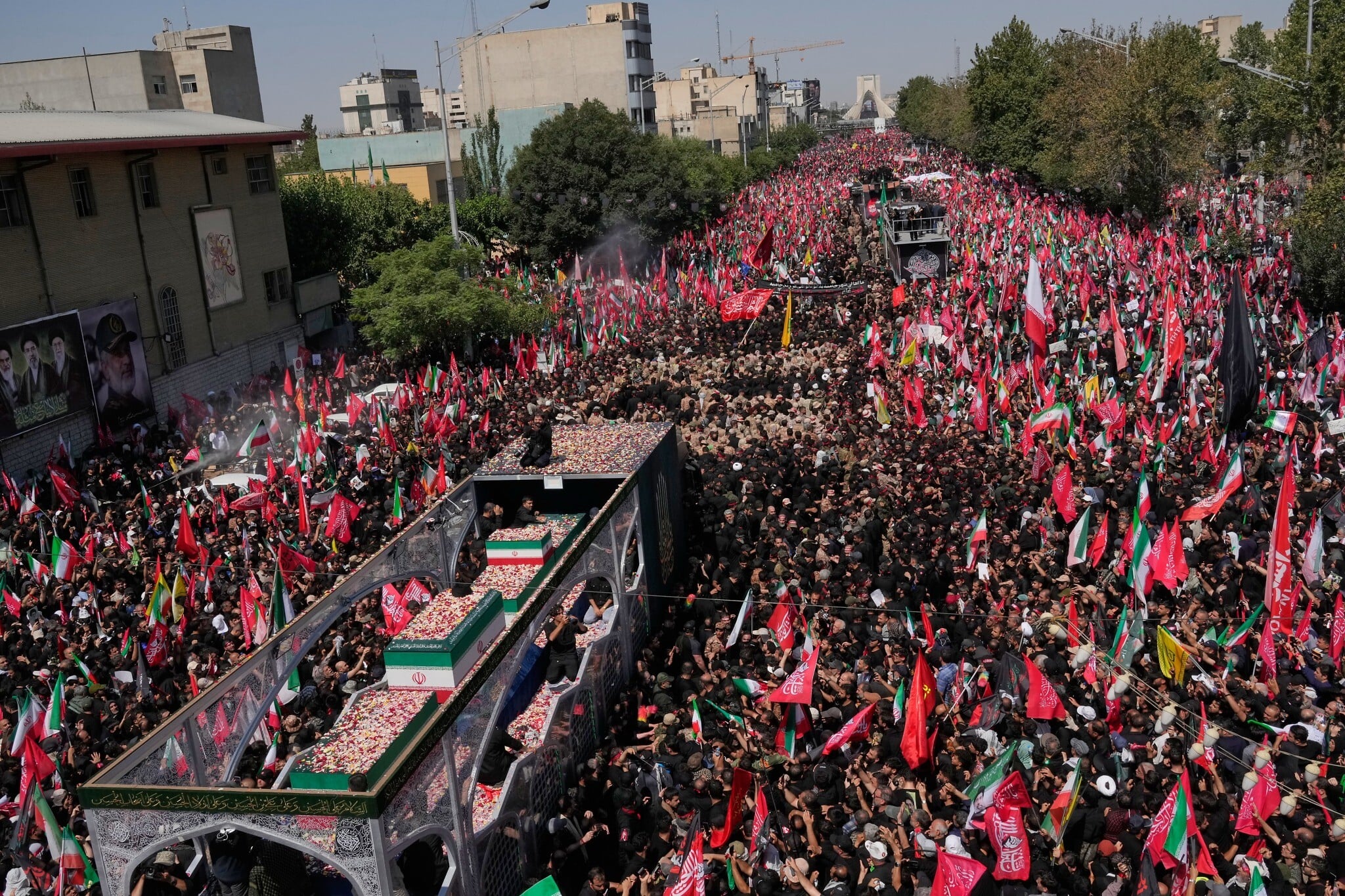 Masses accompany Khamenei funeral procession through Tehran as throngs chant for revenge