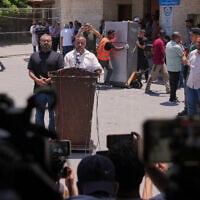 Ismail al-Thawabta, general director of the Hamas-run government media office, center right, speaks during a press conference at Al-Aqsa Hospital in Deir al-Balah, central Gaza Strip, July 6, 2026. (AP Photo/Jehad Alshrafi)