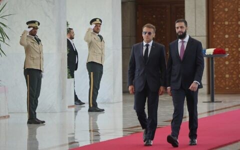 Syrian President Ahmad al-Sharaa, right, meets French President Emmanuel Macron at the presidential palace in Damascus, Syria, July 7, 2026. (AP/Ghaith Alsayed)